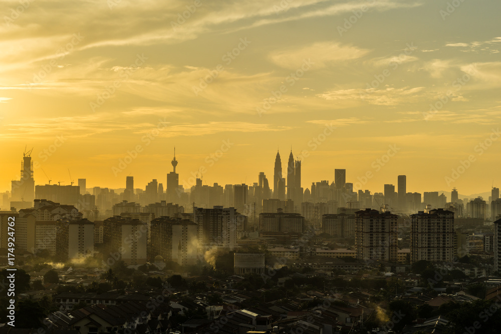 Majestic sunset over silhouette of downtown Kuala Lumpur, Malaysia
