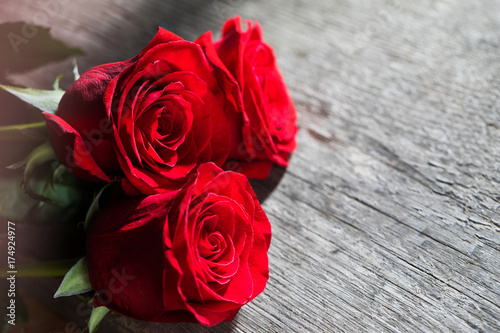 Red roses on wood