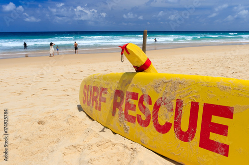 Yellow surf rescue board by the sea beach.