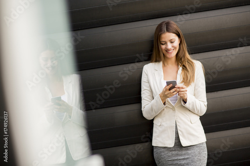 Businesswoman using mobile ...