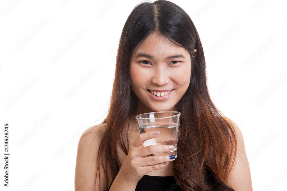 Young Asian woman with a glass of drinking water. Young Asian woman with a glass of drinking water.