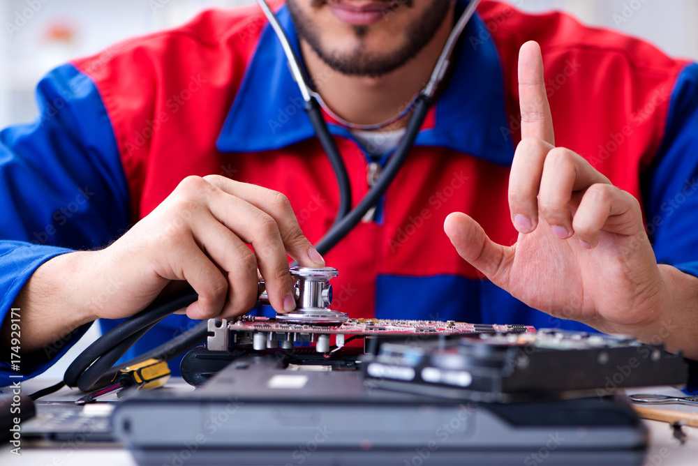 Repairman working in technical support fixing computer laptop tr Repairman working in technical support fixing computer laptop tr