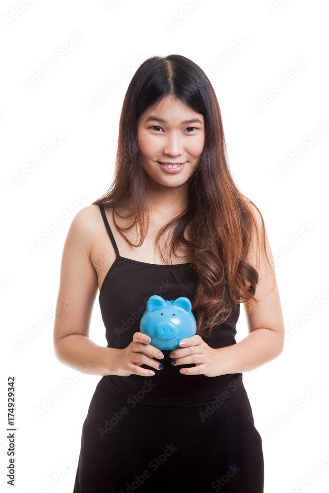 Young Asian woman with a pig coin bank. Young Asian woman with a pig coin bank.
