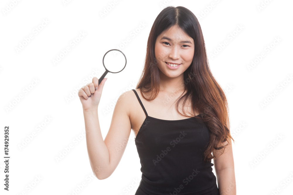 Young Asian woman with a magnifying glass. Young Asian woman with a magnifying glass.