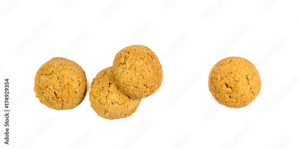 Four scattered ginger nuts in a row seen from above Four scattered ginger nuts in a row seen from above