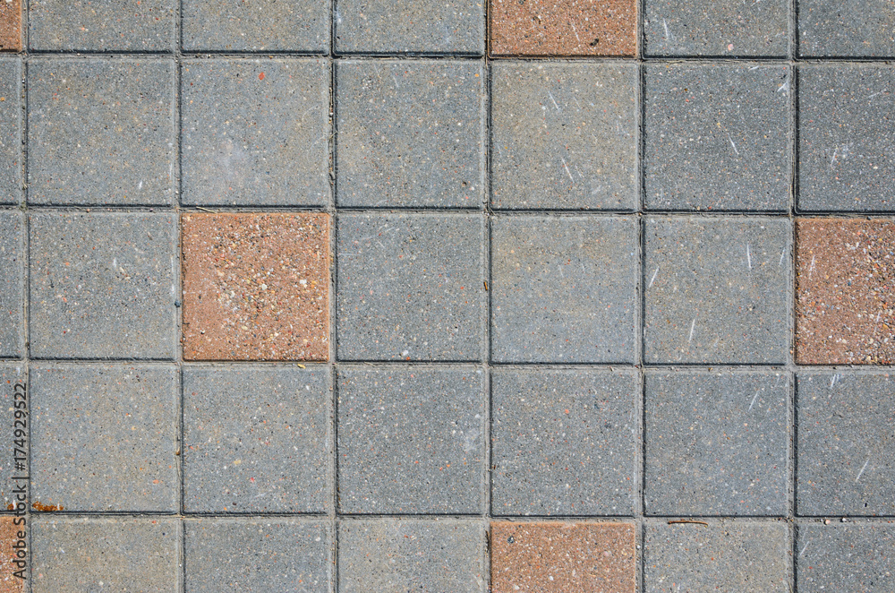 Gray Concrete Square Paving Stone Texture with Inserts from a Red Stone Blocks. Landscaping Background Concept Gray Concrete Square Paving Stone Texture with Inserts from a Red Stone Blocks. Landscaping Background Concept