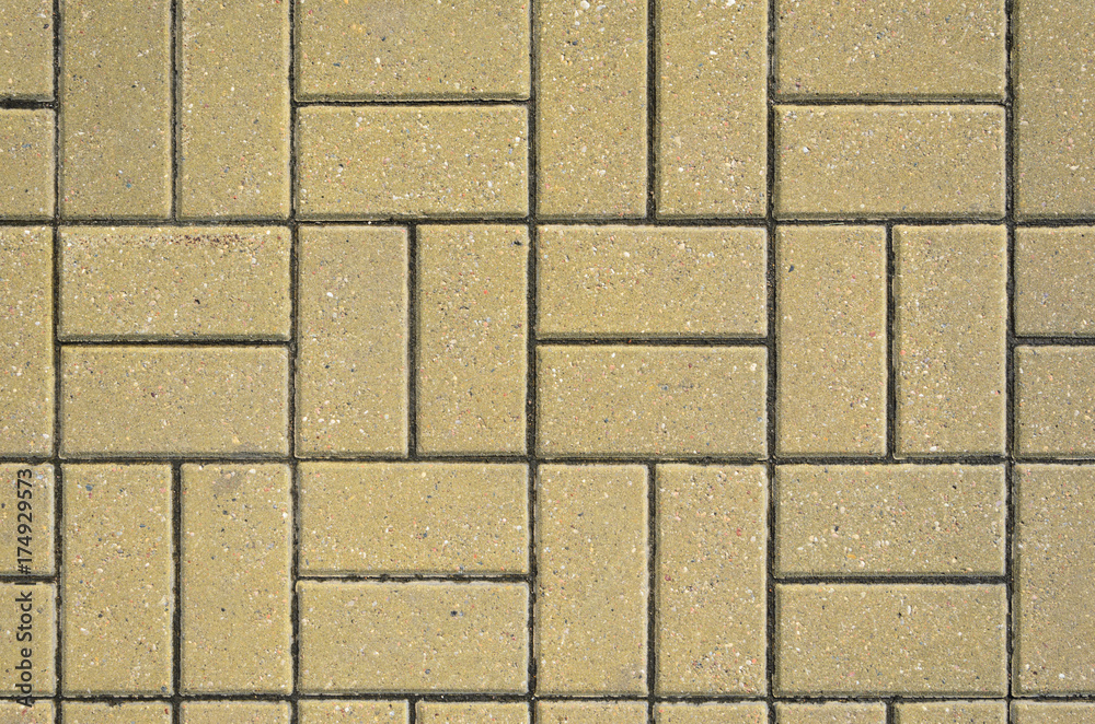 Obraz premium Tiled Mosaic Concrete Pavement of the Road. Pavement Texture