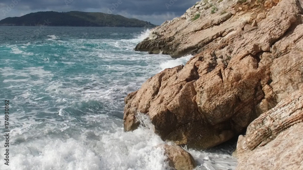 Pure Blue Waters Sea, Coastal Waves Breaking And Splashing Adventure On Sea Coast Surf Rocks. Footage. Summer