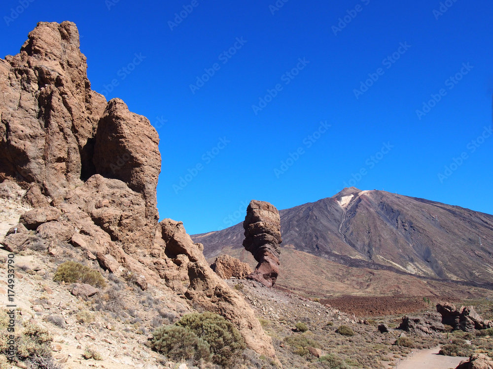mountains and large rock formations in the volcanic landscape of teide national park tenerife