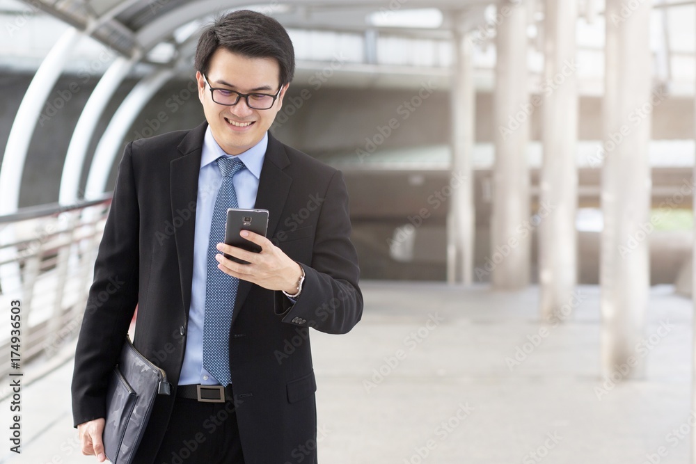 close up of Young Man using phone or Business man Contact Customer close up of Young Man using phone or Business man Contact Customer