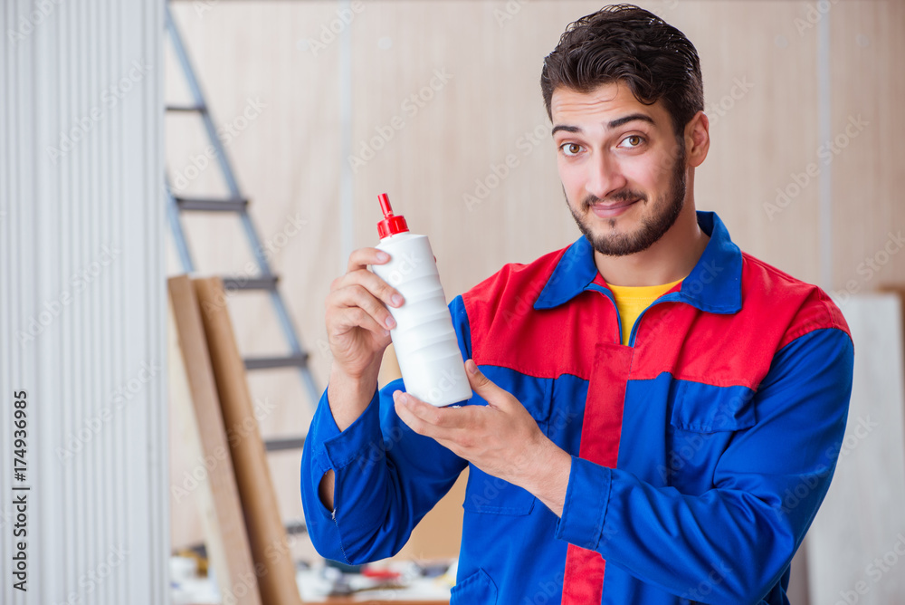 Yooung repairman carpenter working with paint painting Yooung repairman carpenter working with paint painting