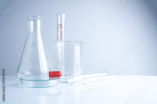 Laboratory glassware on table, Symbolic of science research.
