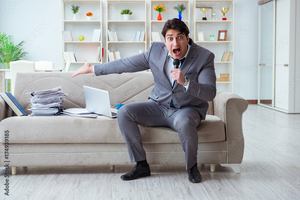 Sad businessman singing in office