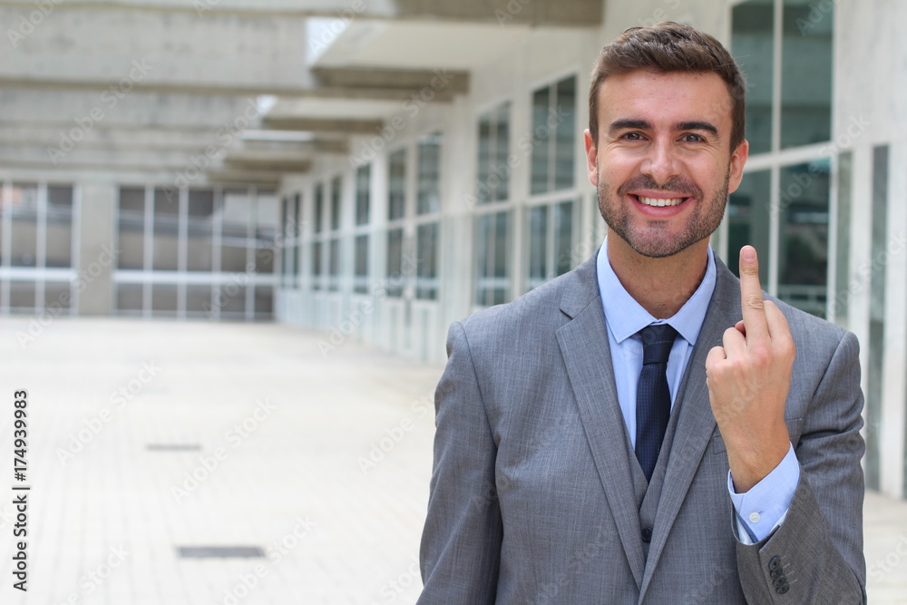 Ironic businessman showing a middle finger