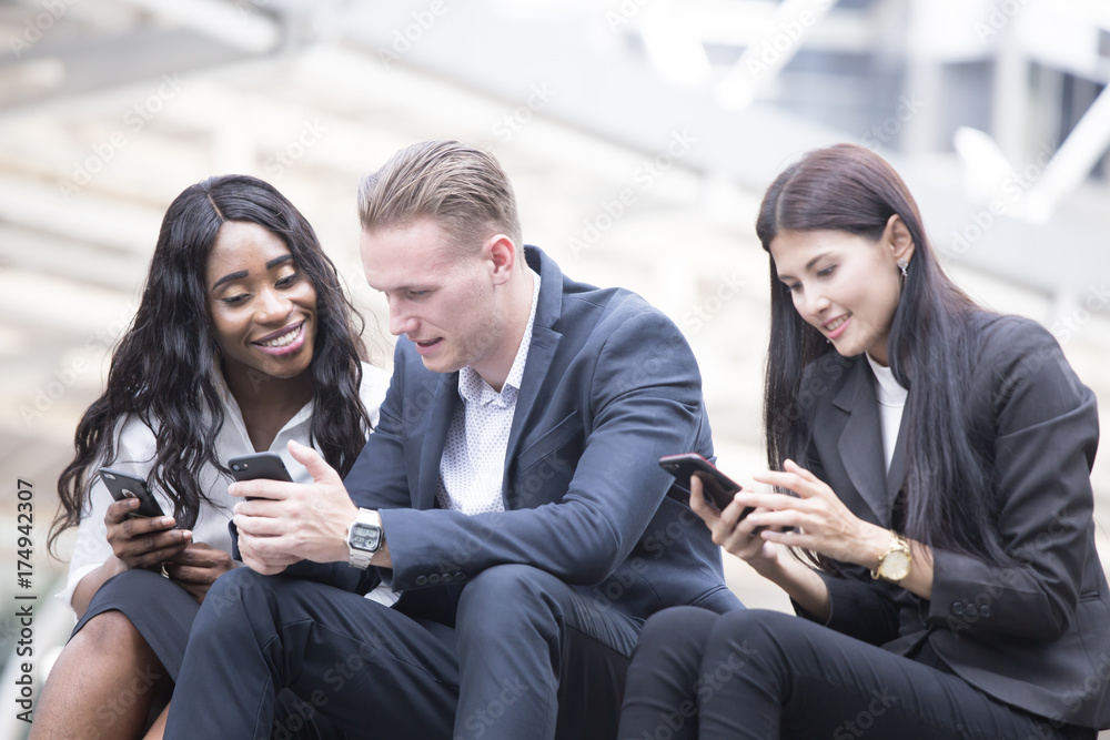 Businesspeople using Smartphont at City, People using Smartphone with happy emotion.