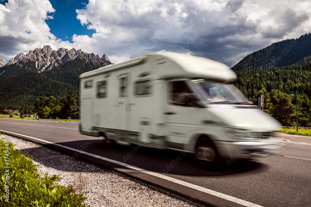 Family vacation travel, holiday trip in motorhome RV, caravan car motion blur