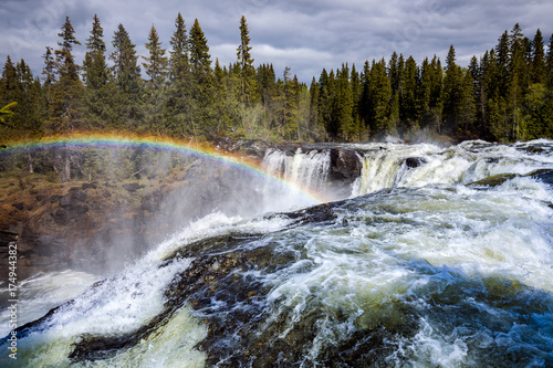 Fototapeta Naklejka Na Ścianę i Meble -  Ristafallet waterfall in the western part of Jamtland is listed as one of the most beautiful waterfalls in Sweden.