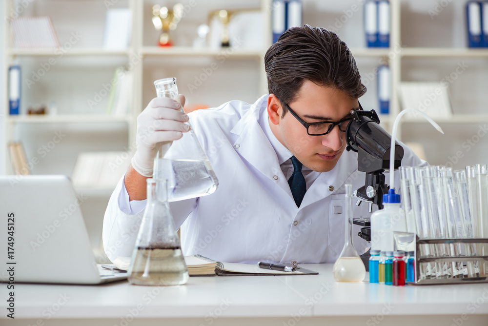 Young researcher scientist doing a water test contamination expe Young researcher scientist doing a water test contamination expe