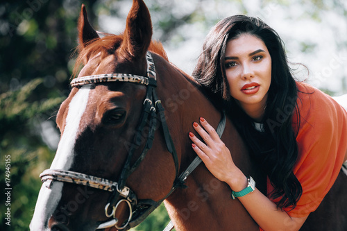beautiful brunette with a horse