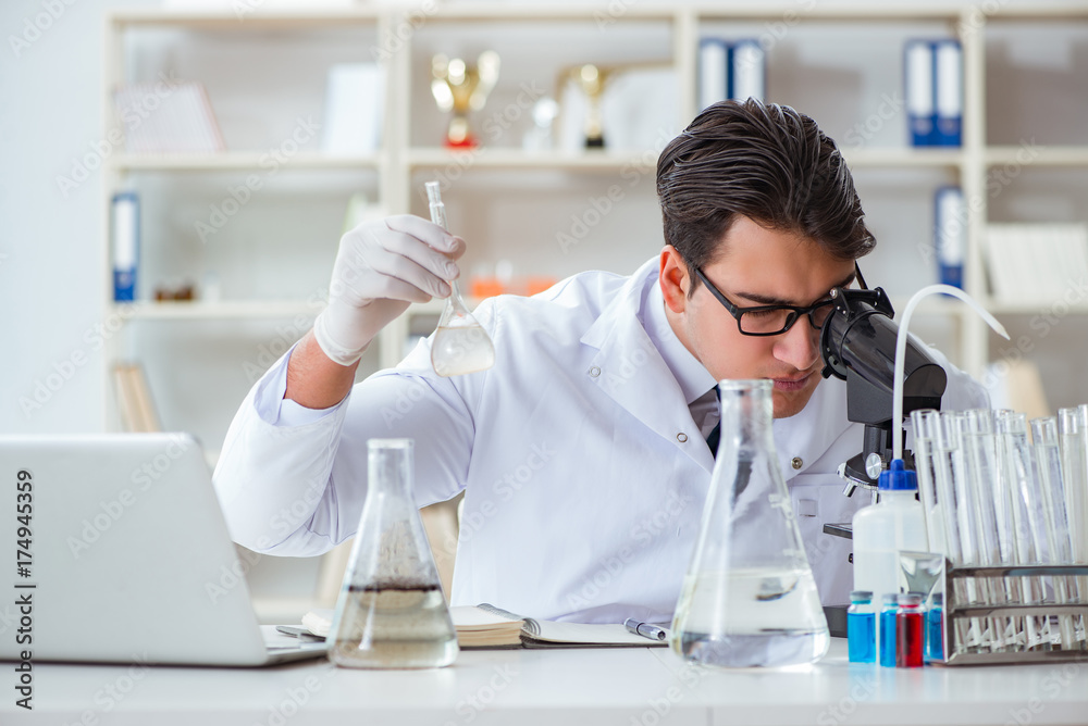 Young researcher scientist doing a water test contamination expe Young researcher scientist doing a water test contamination expe