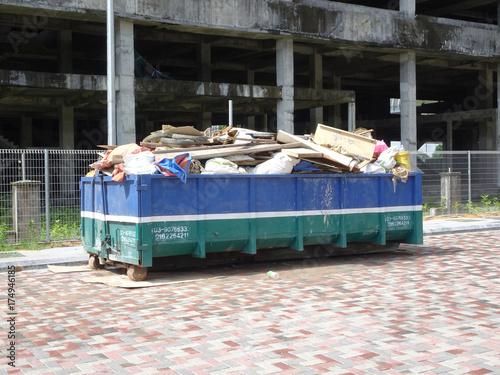 Construction wasted disposal bin used to collect rubbish and unused material at the construction site.