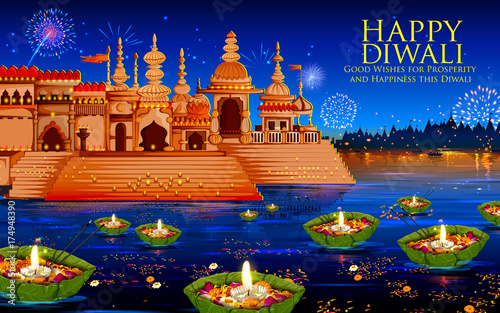 Floating diya in river on Happy Diwali Holiday background for light festival of India