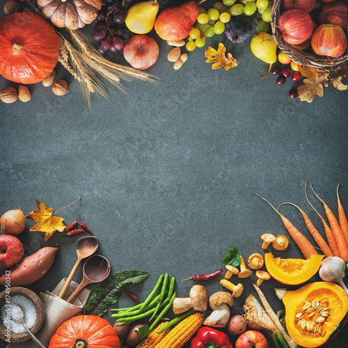 Thanksgiving day or seasonal autumnal background with pumpkins, vegetables and fruits