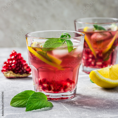 Alcohol free pomegranate, lemon, mint  drink. Selective focus, space for text. 
