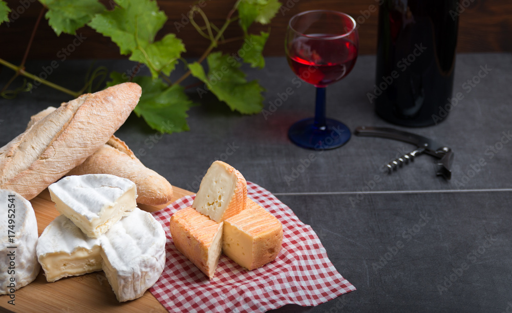 variation of cheese and wine and bread