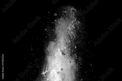 Papier peint Explosion of white dust on black background.