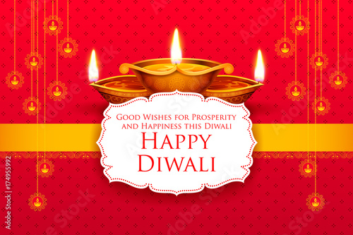 Burning diya on Happy Diwali Holiday background for light festival of India