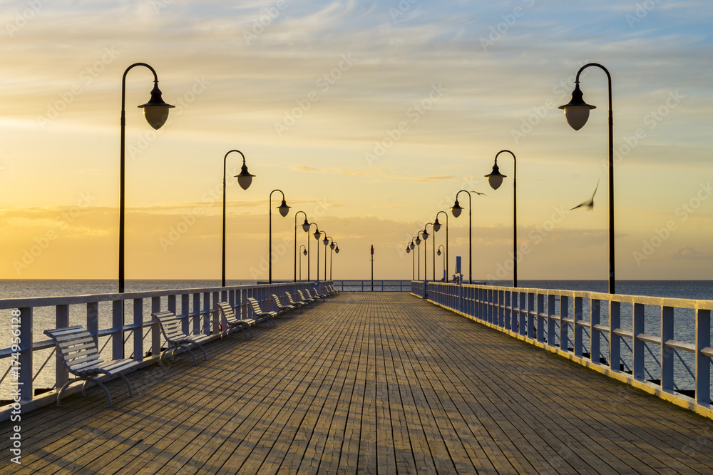 Beautiful sunrise over a wooden pier in Gdynia, Poland