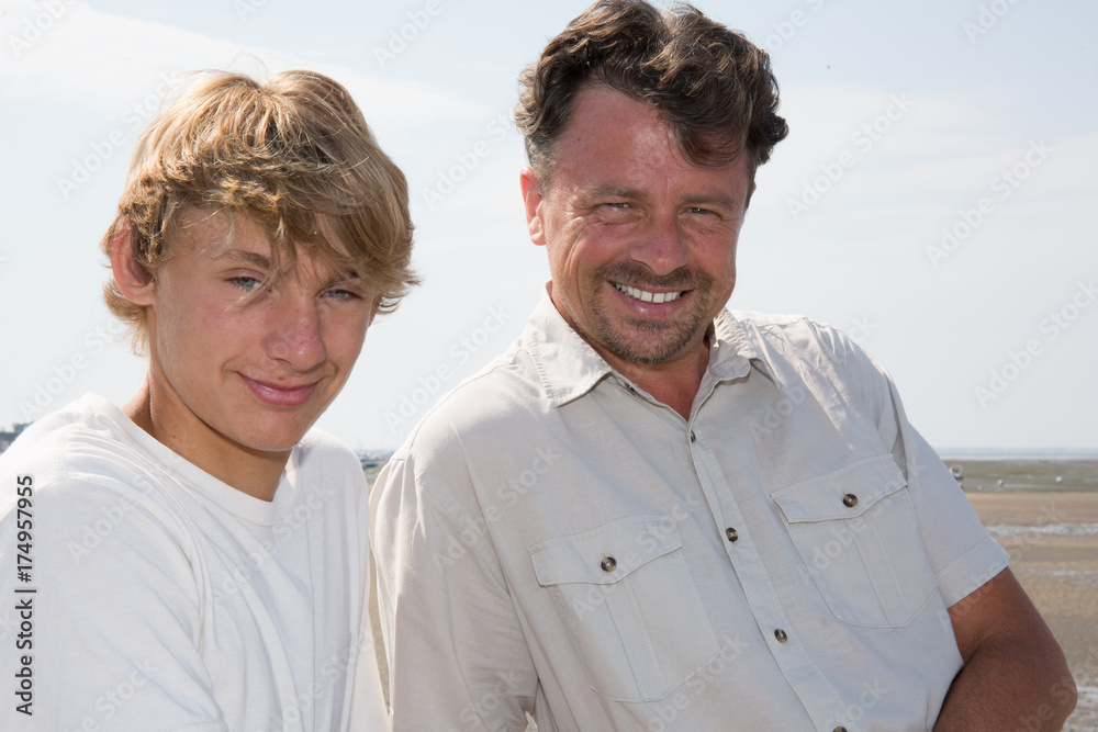 Father and son on vacation summer tourism on the seaside Father and son on vacation summer tourism on the seaside