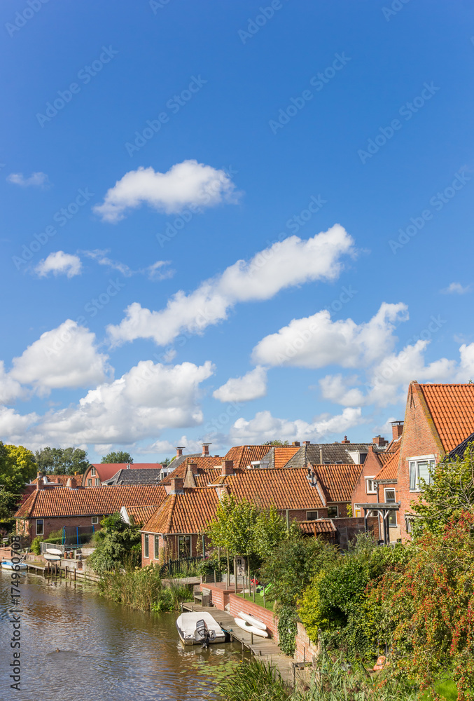 Old houses and river in the village of Winsum Old houses and river in the village of Winsum