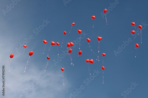 red balloons flying to the sky photo