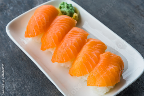Fresh Japanese Salmon Sushi in white dish with Wasabi