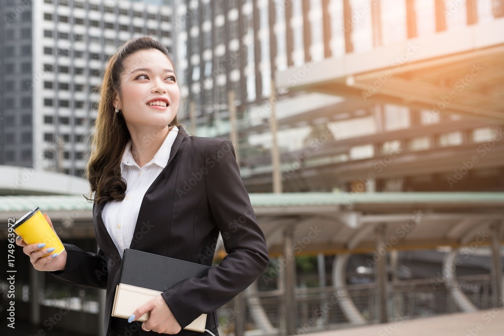 Business woman happy smile on something imaginary  look to success. concept working woman.
