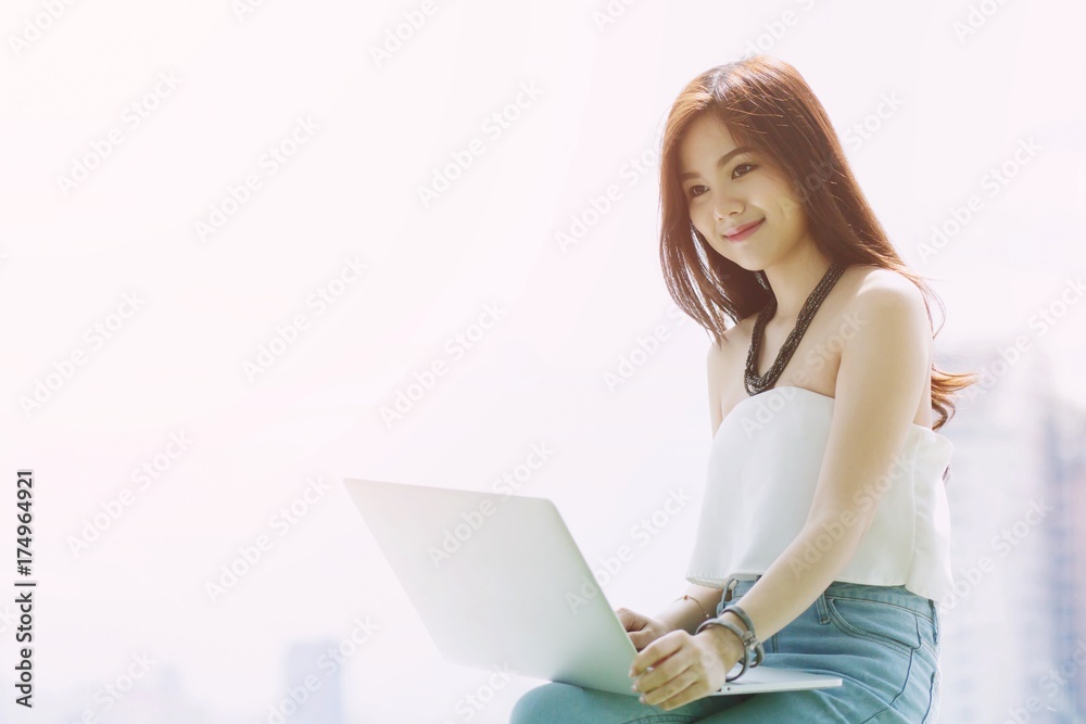 Businesswoman on break. or college student using her computer notebook