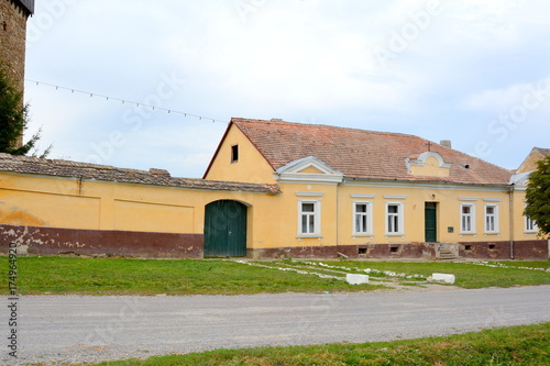 Typical rural landscape and peasant houses in Barcut, Bekokten, Brekolten, Transylvania, Romania. The settlement was founded by the Saxon colonists  photo