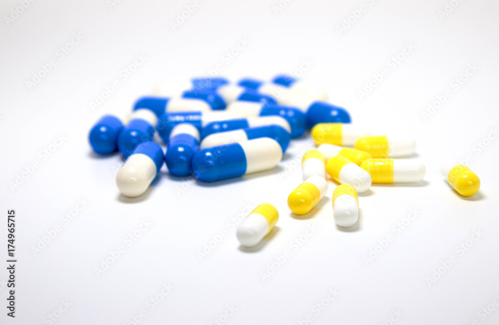 Background of assorted pharmaceutical capsules and medication in different colors. Background of assorted pharmaceutical capsules and medication in different colors.