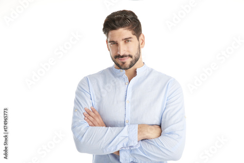 Confident young man against white background