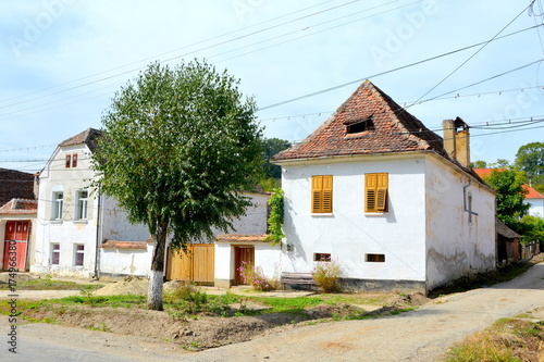 Typical rural landscape and peasant houses in Bradeni, Henndorf, Hegendorf,  Transylvania, Romania. The settlement was founded by the Saxon colonists photo