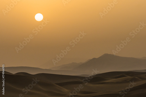 Silhouette of sunset on the desert in Xinjiang, China