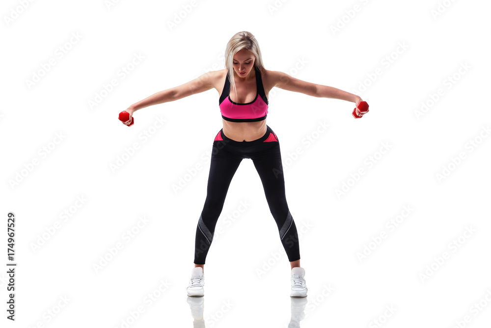 Fit woman doing exercise with dumbbells