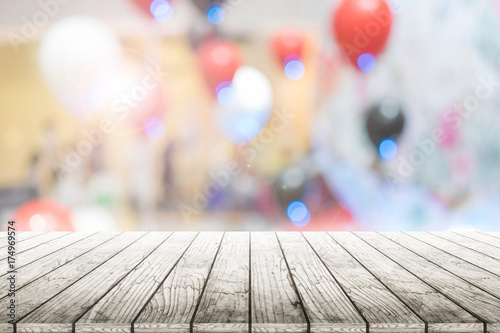 Empty wooden table with party in wedding background blurred.