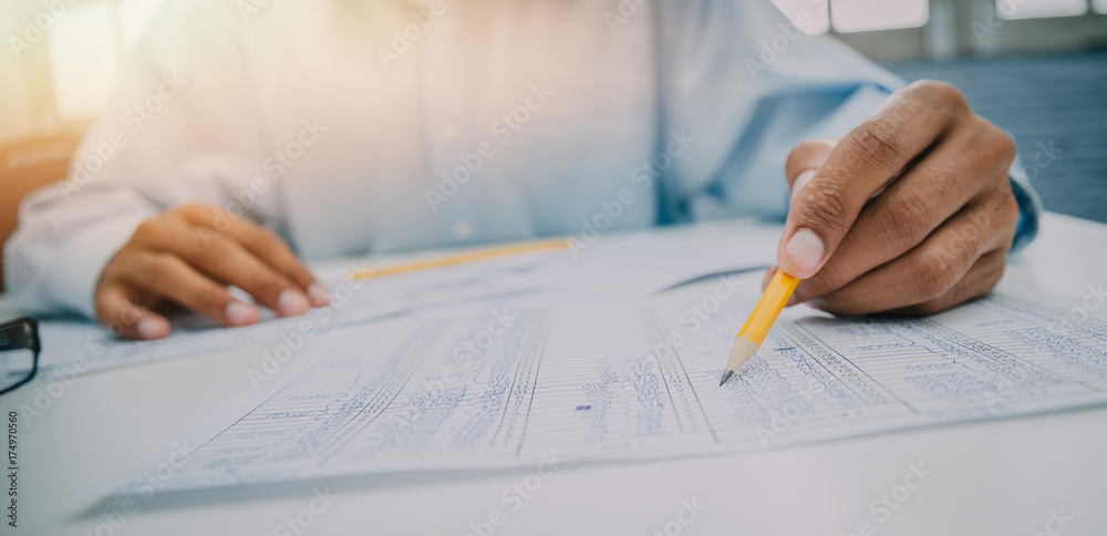 Image of financial worker analyzing statistical data,Financial business concept Image of financial worker analyzing statistical data,Financial business concept