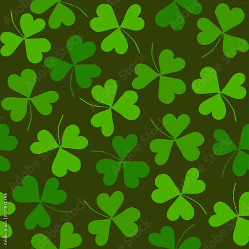 Seamless pattern with clover on a green background