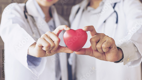 Couple making heart shape with hands
