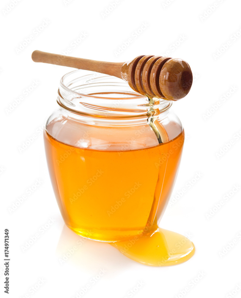 glass jar full of honey and dipper glass jar full of honey and dipper