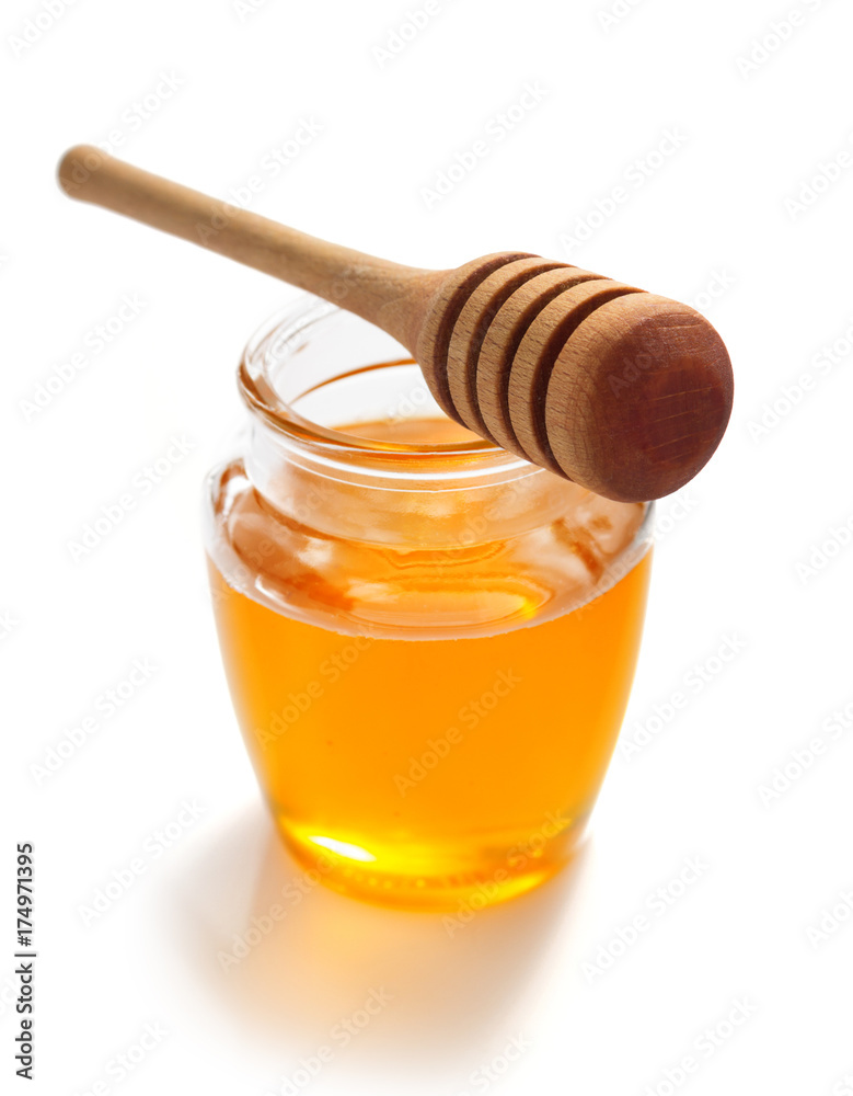 jar of honey and dipper on white background jar of honey and dipper on white background